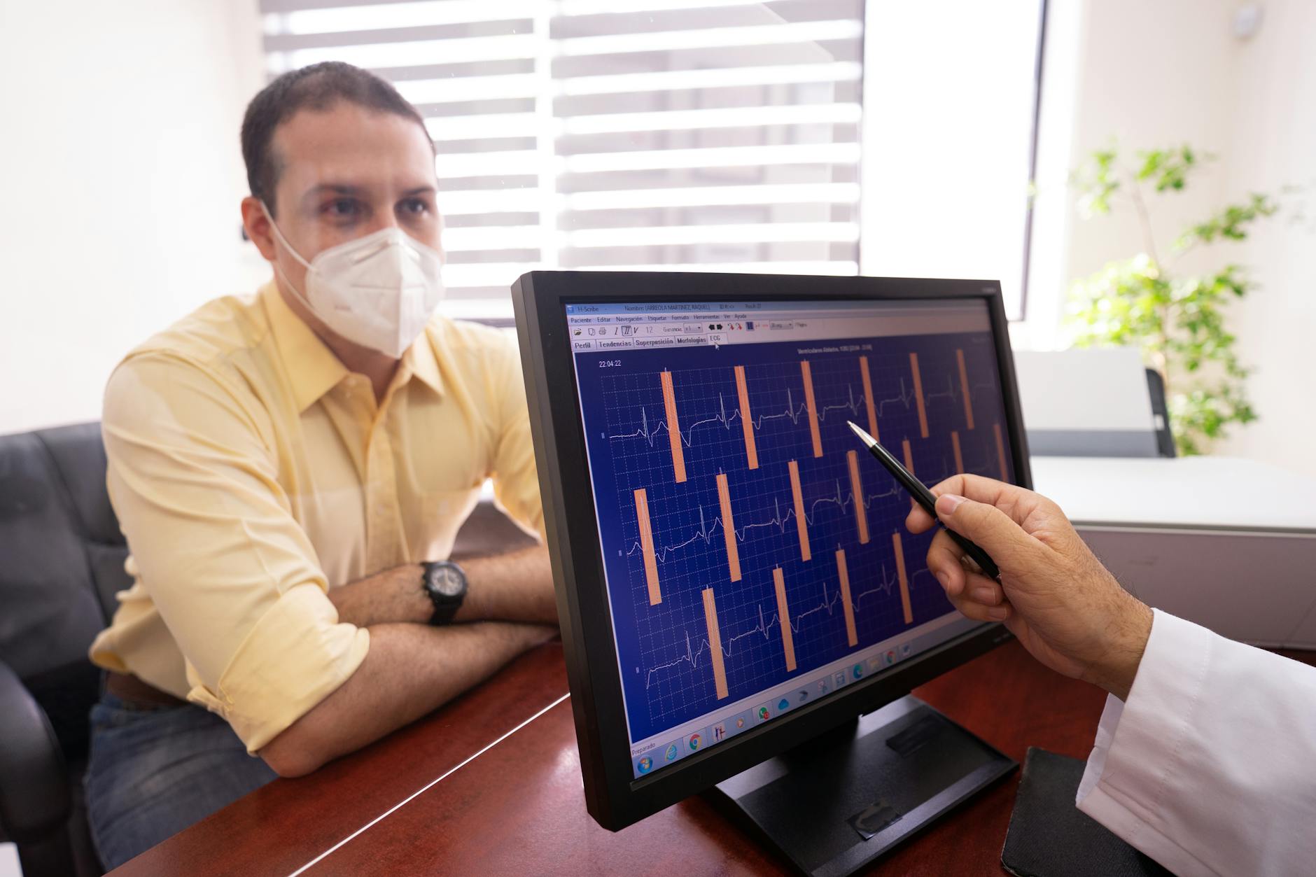 Cardiologist examining electrocardiogram trace — TRAVERSE trial cardiovascular safety of testosterone replacement therapy