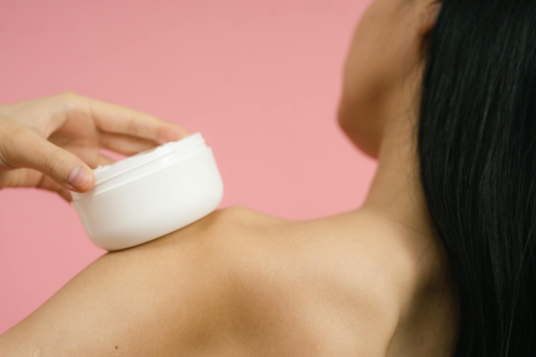 Woman's healthy glowing skin examined by skincare specialist with serum — GHK-Cu copper peptide skin aging research