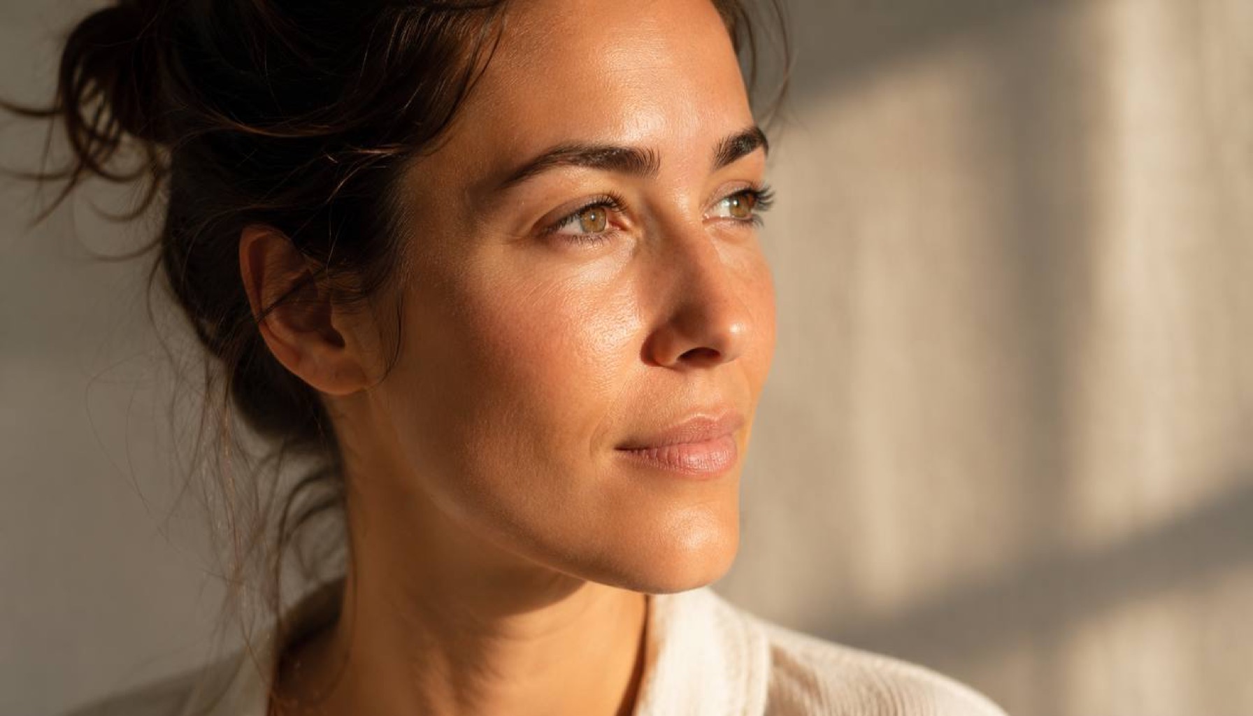 Editorial portrait of clear healthy skin under natural light — representing liver-mediated clearance and glutathione status