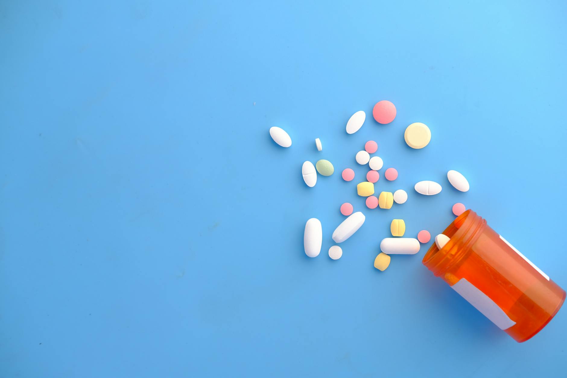 Prescription pill bottle on pharmacy counter — pharmaceuticals prescription drugs